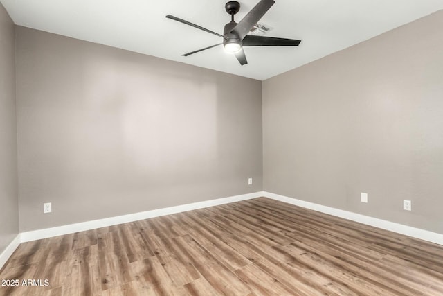 empty room featuring ceiling fan and light wood-type flooring