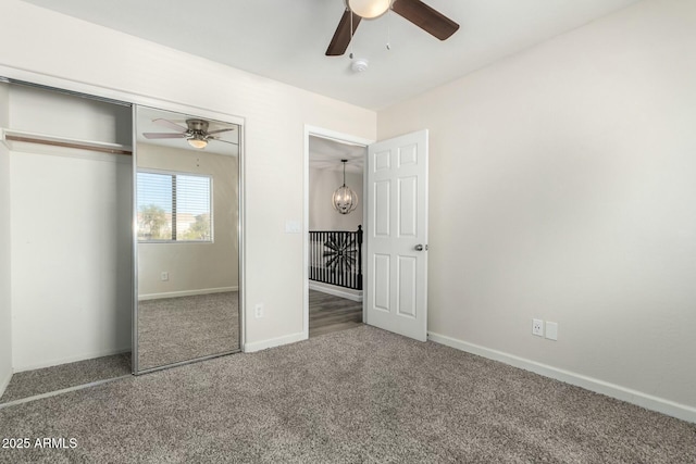 unfurnished bedroom featuring ceiling fan and carpet floors