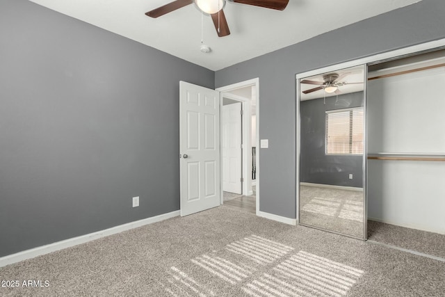 unfurnished bedroom featuring ceiling fan, a closet, and carpet floors