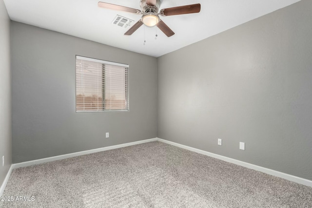 carpeted empty room featuring ceiling fan