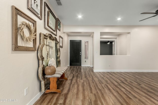 corridor featuring hardwood / wood-style floors