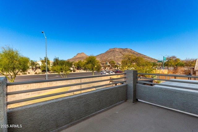 balcony featuring a mountain view