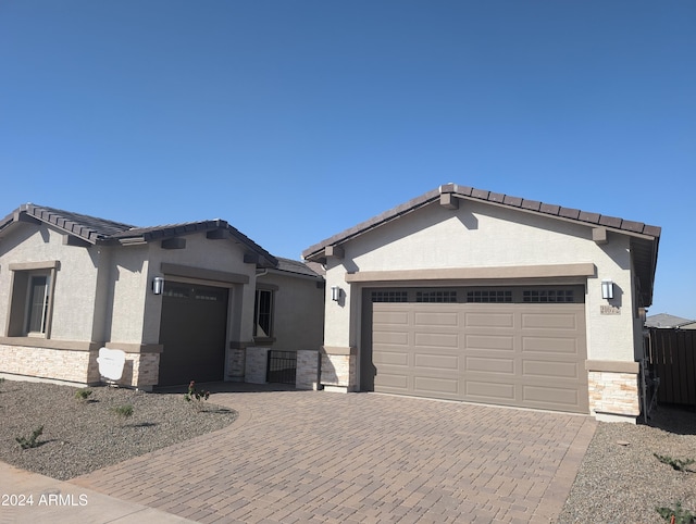 view of front of property with a garage