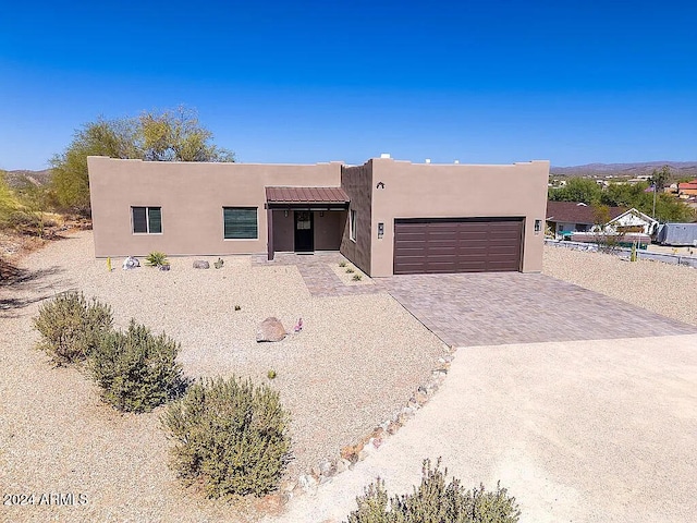 southwest-style home with a garage