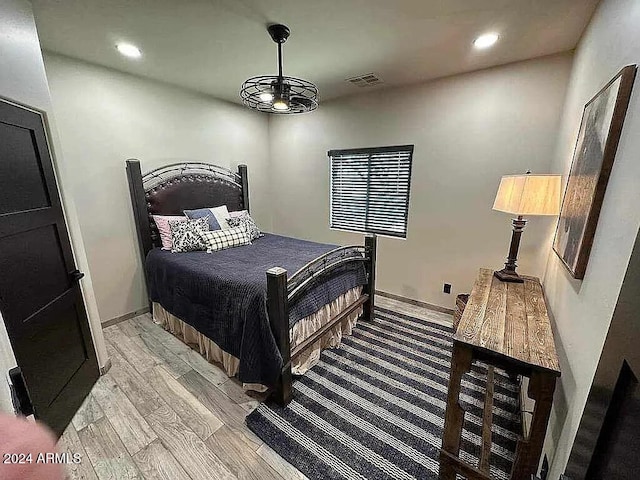 bedroom with light hardwood / wood-style floors