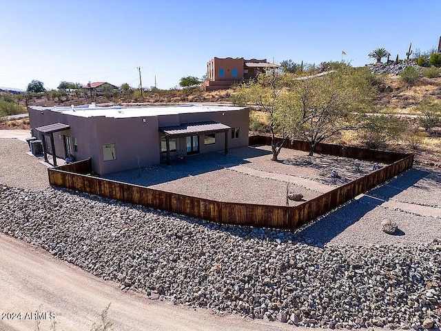 back of property featuring a patio