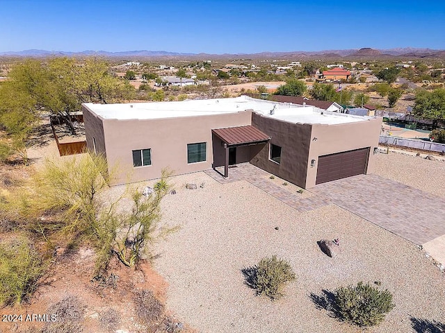 birds eye view of property featuring a mountain view