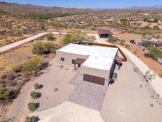 drone / aerial view featuring a mountain view