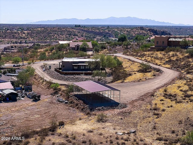 birds eye view of property featuring a mountain view