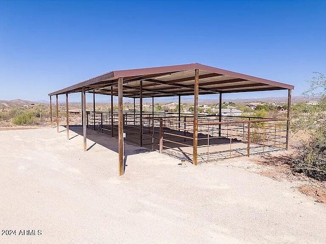 surrounding community featuring a rural view and an outdoor structure