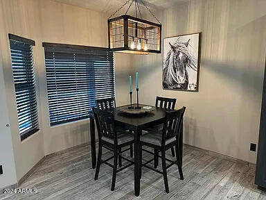 dining area with hardwood / wood-style floors