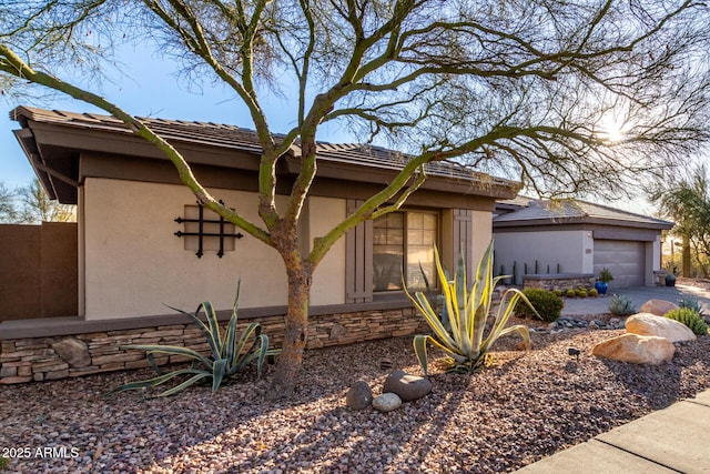 view of property exterior with a garage