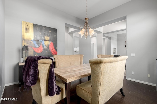 dining area with dark hardwood / wood-style flooring