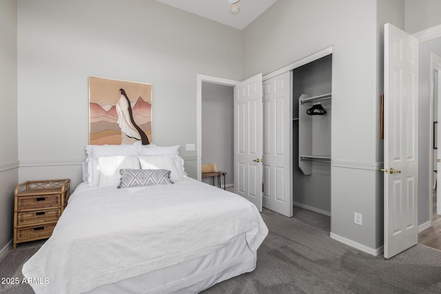 bedroom featuring dark colored carpet and a closet