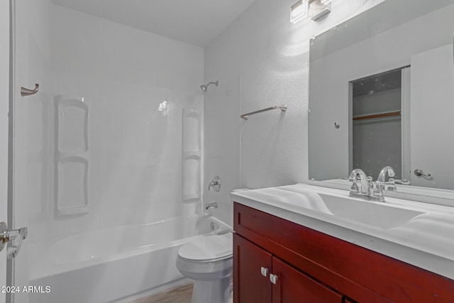 full bathroom with wood-type flooring, vanity, toilet, and shower / washtub combination