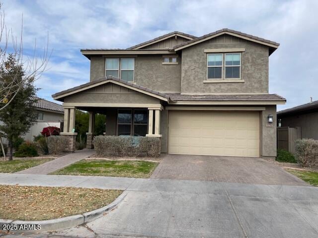 craftsman house with a garage