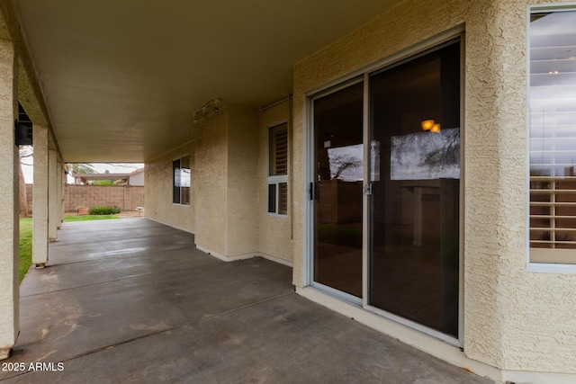 view of patio / terrace featuring fence