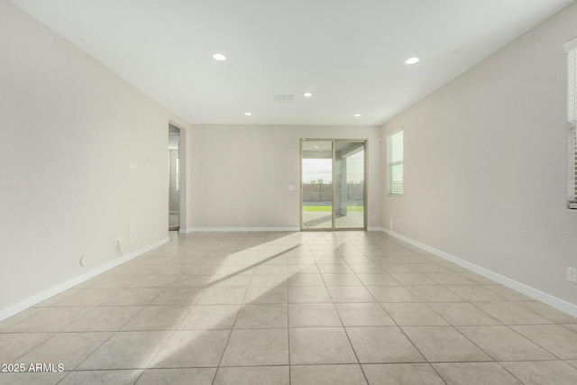 unfurnished room featuring light tile patterned floors