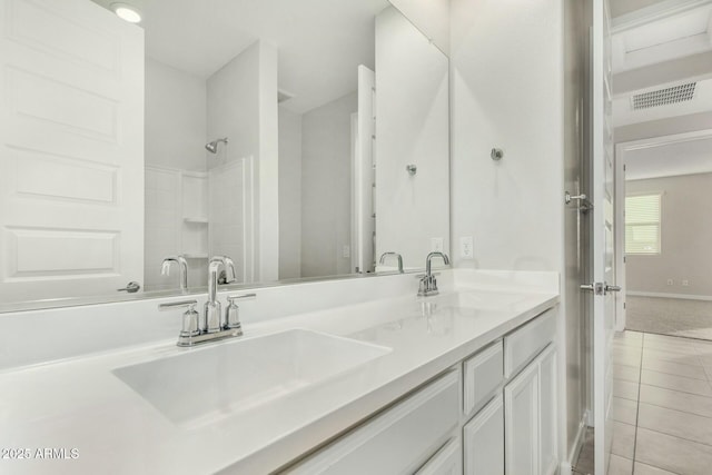 bathroom with vanity and tile patterned floors