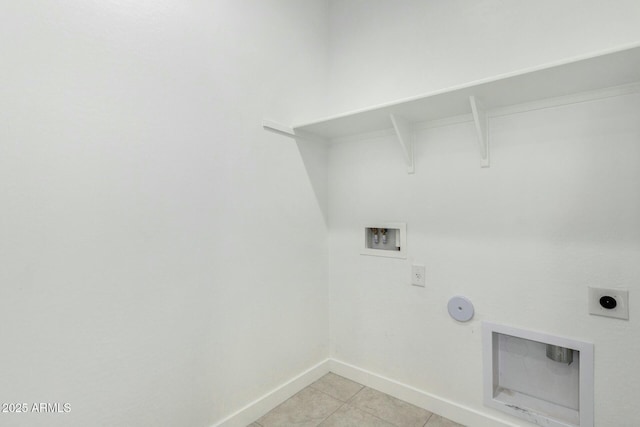 laundry room featuring hookup for a gas dryer, electric dryer hookup, washer hookup, and light tile patterned floors