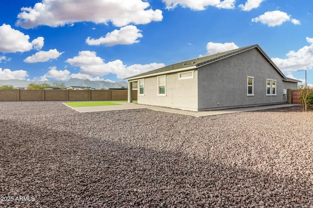 back of property with a patio area