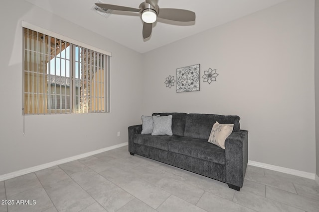 tiled living room featuring ceiling fan