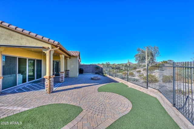 view of yard featuring a patio area and a fire pit