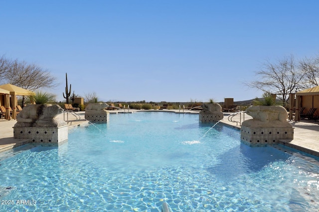 view of pool with pool water feature