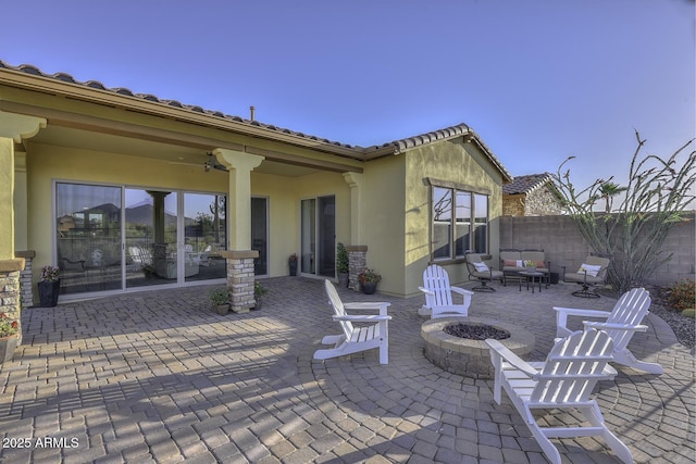 view of patio featuring an outdoor fire pit