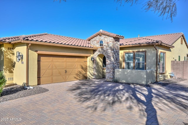 mediterranean / spanish-style home featuring a garage