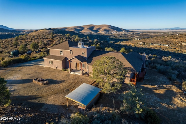 drone / aerial view featuring a mountain view