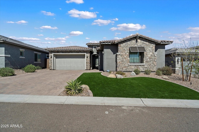 view of front of house featuring driveway, stone siding, an attached garage, a front yard, and a tile roof