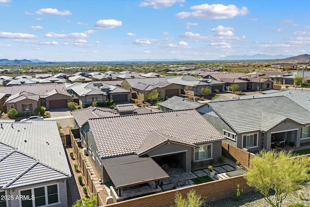 birds eye view of property with a mountain view and a residential view