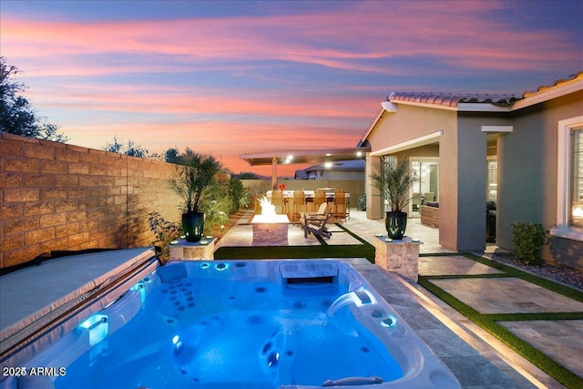 view of swimming pool with a fenced backyard, a patio, and a hot tub