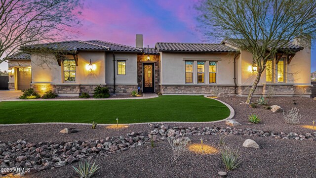 6328 W Fetlock Trl, Phoenix, AZ 85083 - view of front facade featuring stone siding, a tiled roof, a chimney, and a front yard
