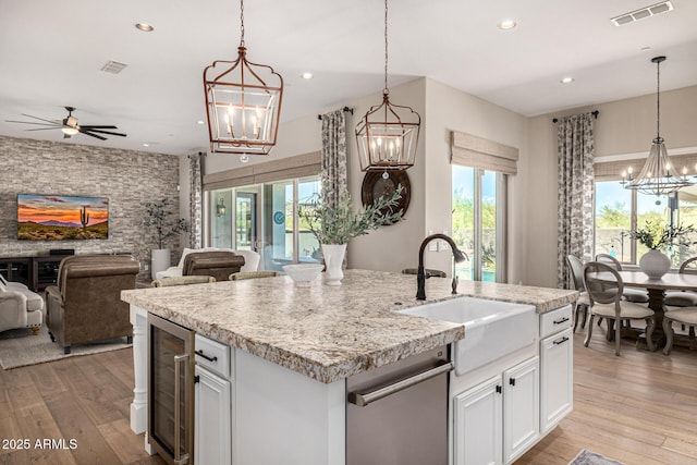 6328 W Fetlock Trl, Phoenix, AZ 85083 - kitchen featuring open floor plan, beverage cooler, visible vents, and a sink