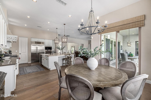 6328 W Fetlock Trl, Phoenix, AZ 85083 - dining area featuring visible vents, a notable chandelier, dark wood finished floors, recessed lighting, and baseboards