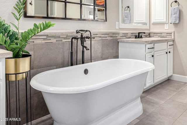 6328 W Fetlock Trl, Phoenix, AZ 85083 - bathroom featuring tile patterned floors, vanity, tile walls, and a freestanding tub