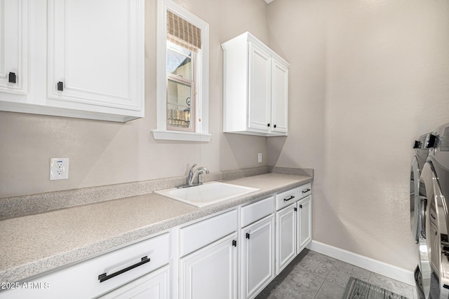 6328 W Fetlock Trl, Phoenix, AZ 85083 - laundry room featuring cabinet space, independent washer and dryer, baseboards, and a sink