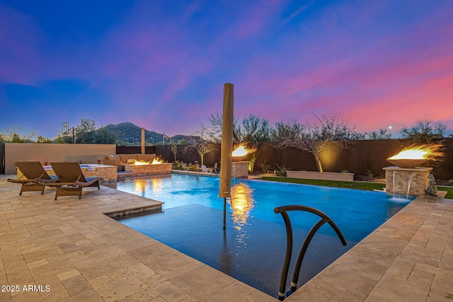 6328 W Fetlock Trl, Phoenix, AZ 85083 - pool at dusk with a fenced in pool, a patio, and a fenced backyard