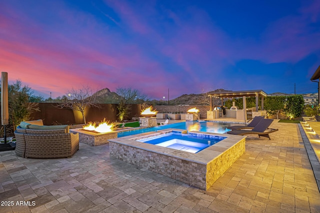 6328 W Fetlock Trl, Phoenix, AZ 85083 - view of pool with area for grilling, a fenced backyard, a fire pit, an in ground hot tub, and a patio area
