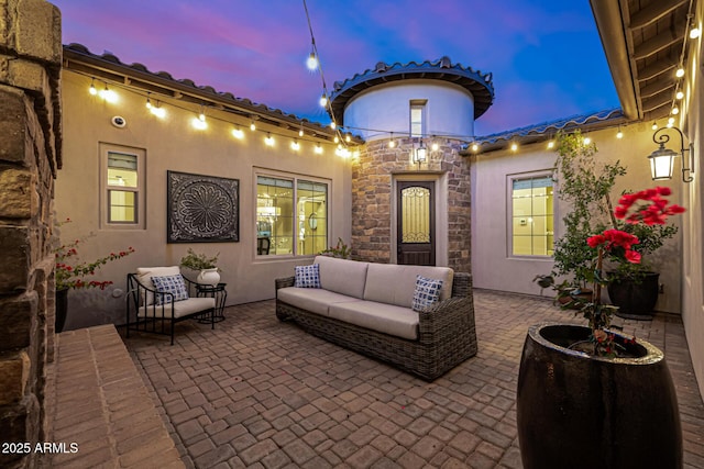 6328 W Fetlock Trl, Phoenix, AZ 85083 - patio terrace at dusk with an outdoor living space