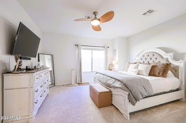 bedroom featuring ceiling fan and light colored carpet