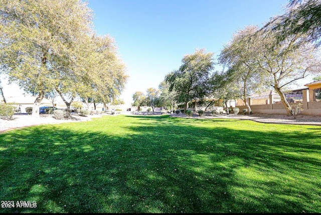 surrounding community featuring a lawn