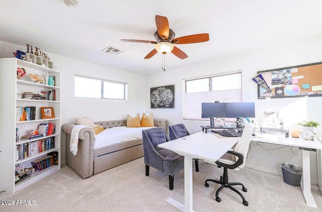 carpeted office with ceiling fan