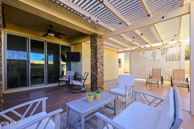 view of patio / terrace with ceiling fan and a pergola