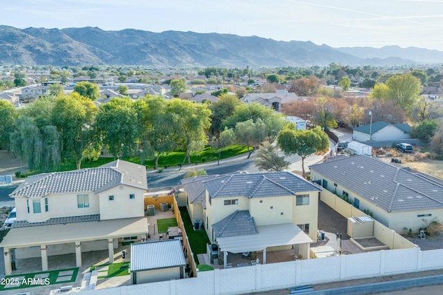 birds eye view of property featuring a mountain view