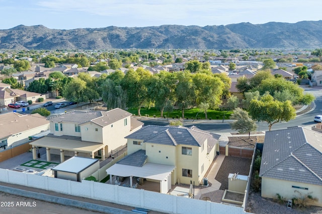 birds eye view of property featuring a mountain view