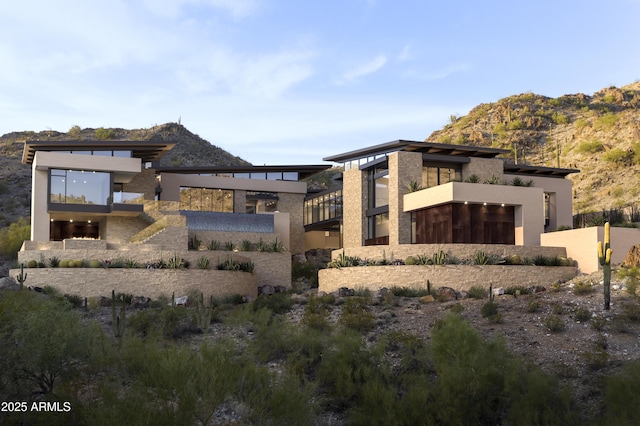 back of house featuring a mountain view