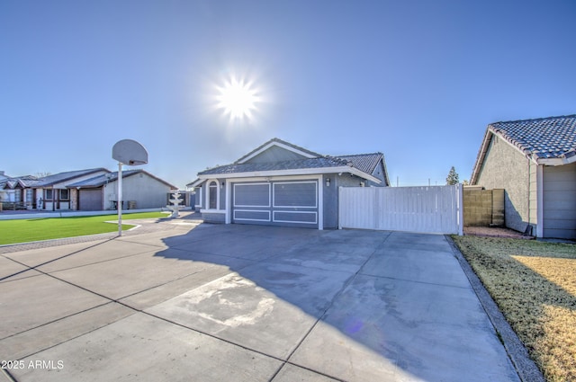 ranch-style home featuring a garage and a front lawn